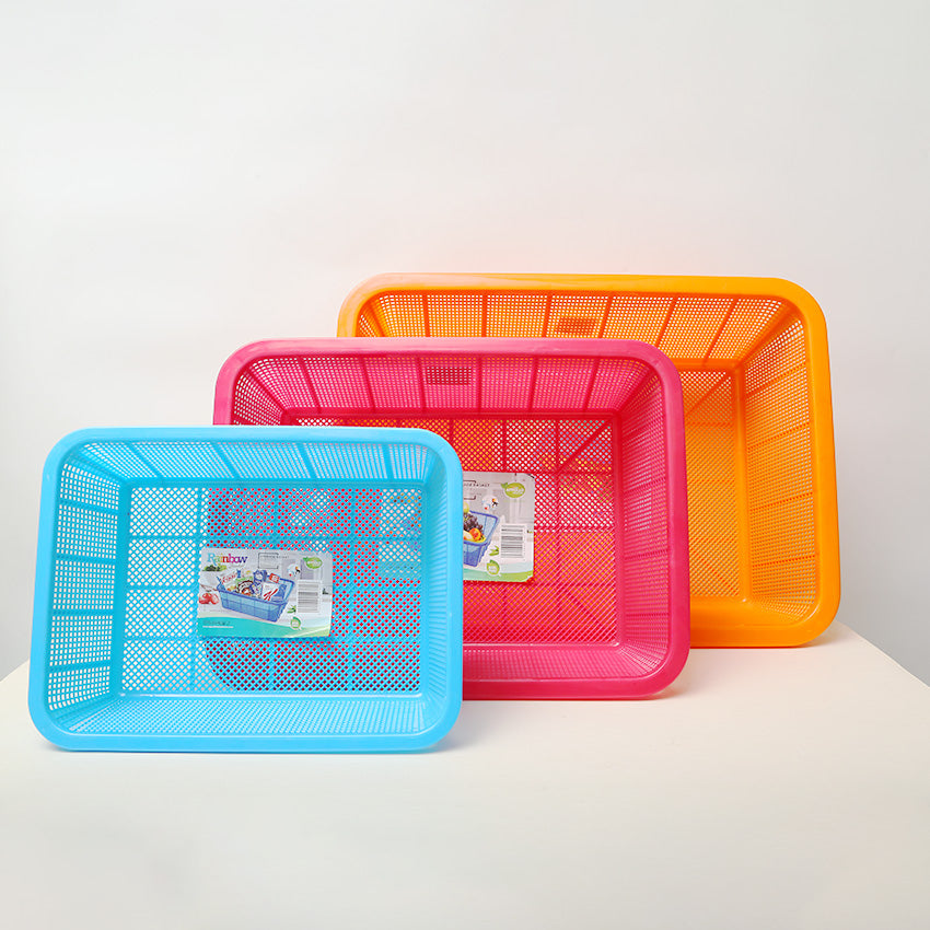 Three colorful plastic baskets on a white background