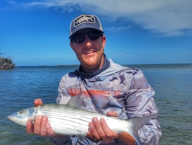 angler with a nice bonefish caught fly fishing in the florida keys